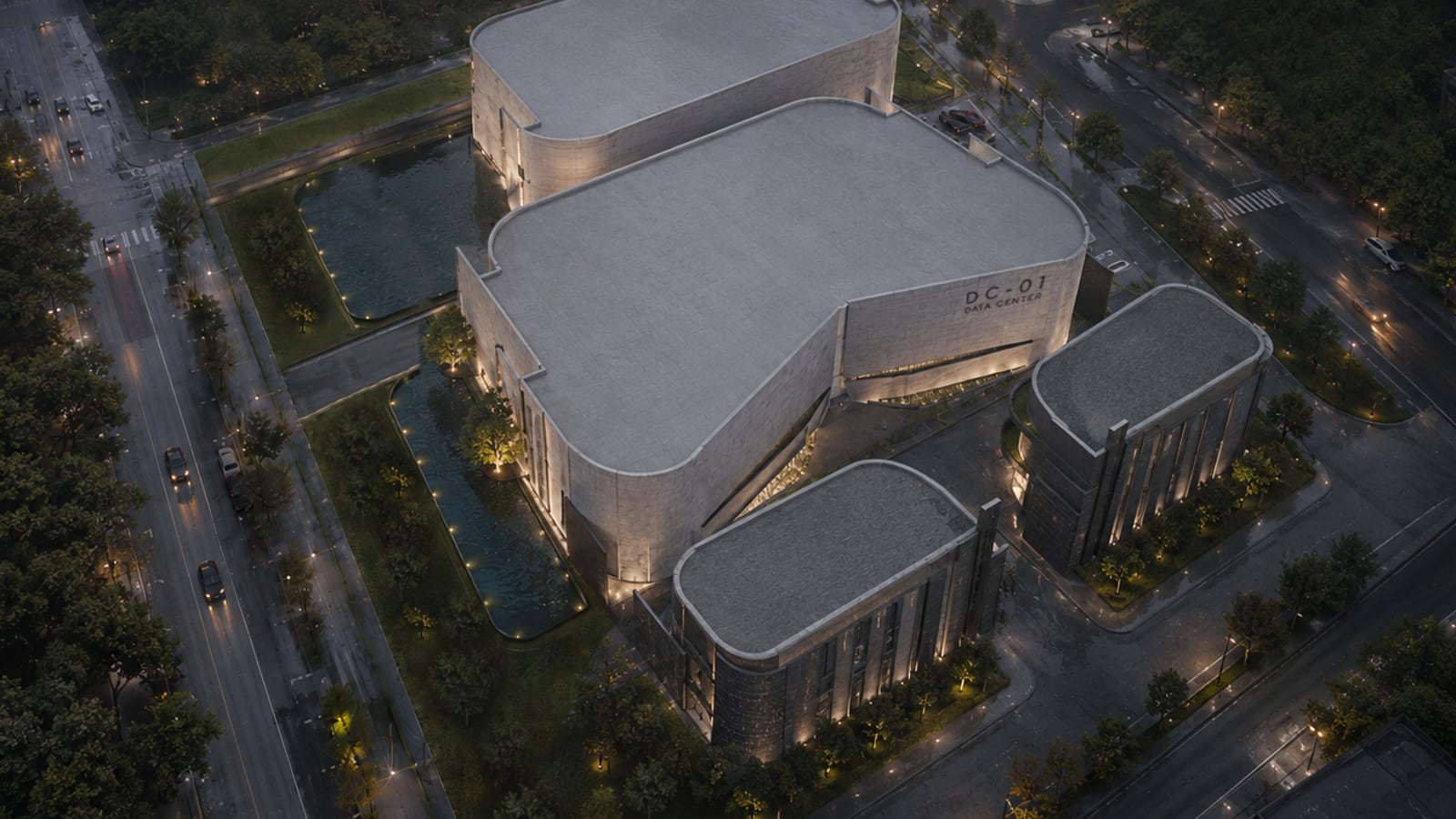 Data center aux volumes de béton arrondis, vue aérienne de nuit