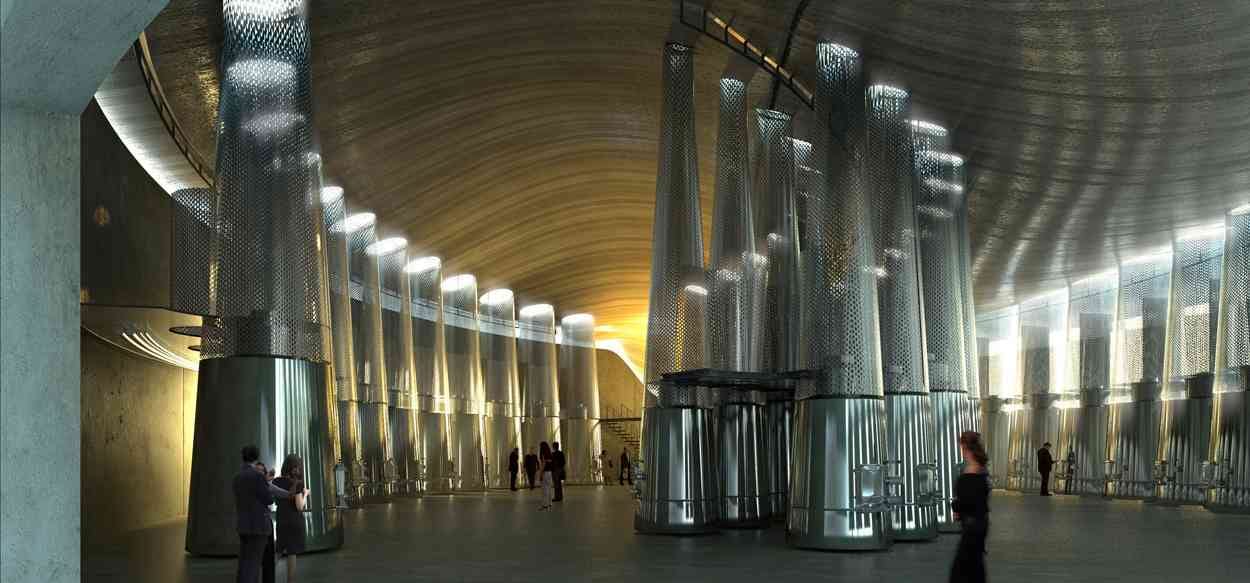 Symmetrical alignment of curved concrete vats in a bright, modern winery, Château Cheval Blanc in Saint-Émilion