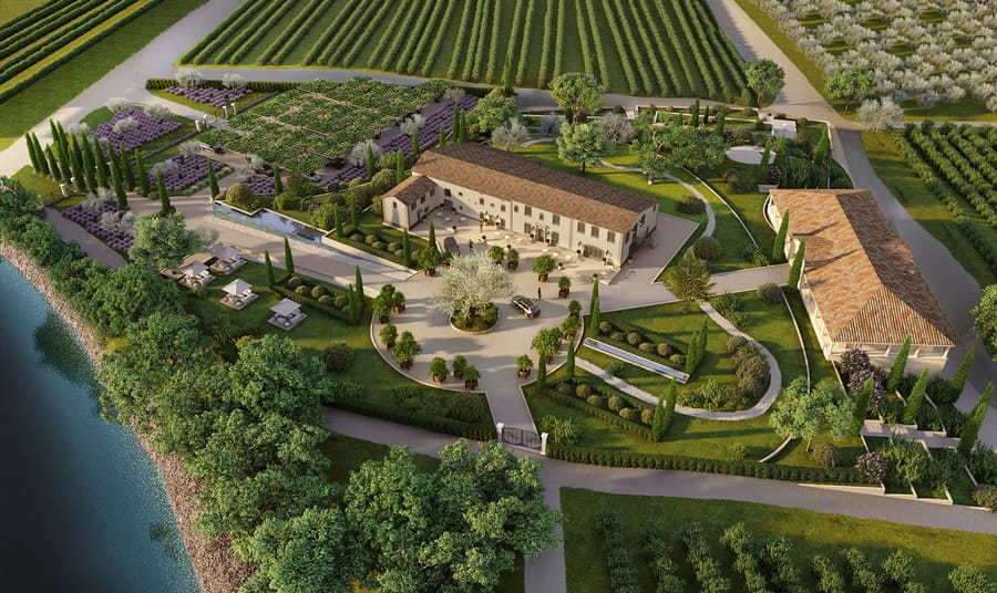 Vue aérienne d'un domaine aux toits de tuiles, entouré de jardins paysagers, de champs cultivés et d'un cours d'eau