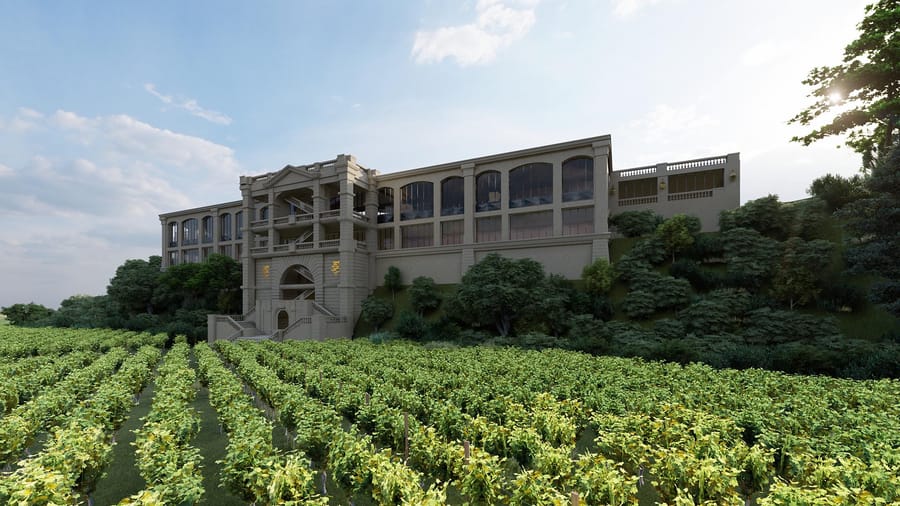 Grand bâtiment d'un domaine viticole surplombant des rangs de vignes verdoyants, Château Plain Point à Fronsac