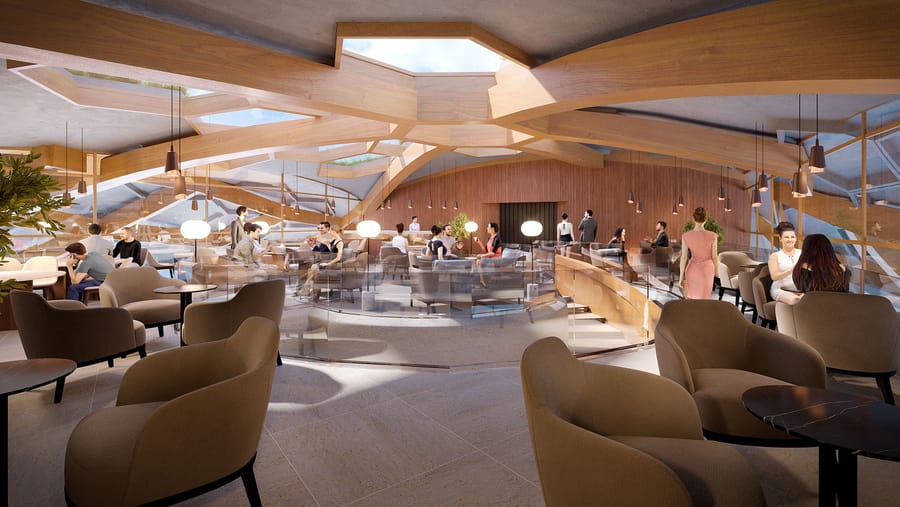Espace lounge lumineux aménagé avec des fauteuils sous une structure en bois dotée de puits de lumière, dans un hôtel, Hôtel Agassac à Ludon-Médoc